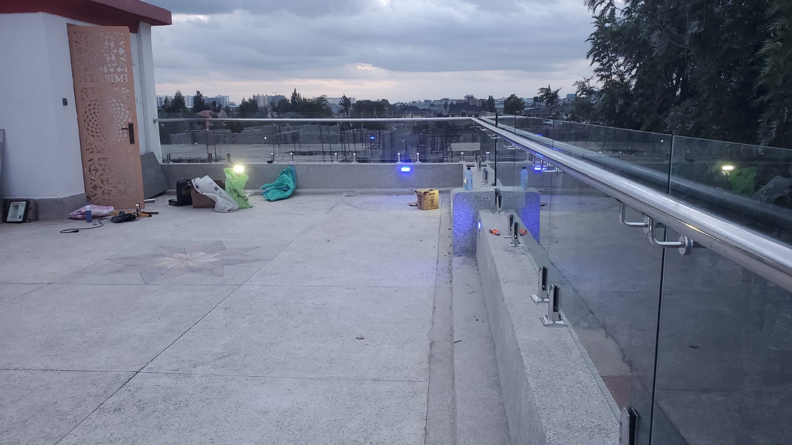 Frameless glass balustrade installed on a rooftop terrace by BestLink Fabricators
